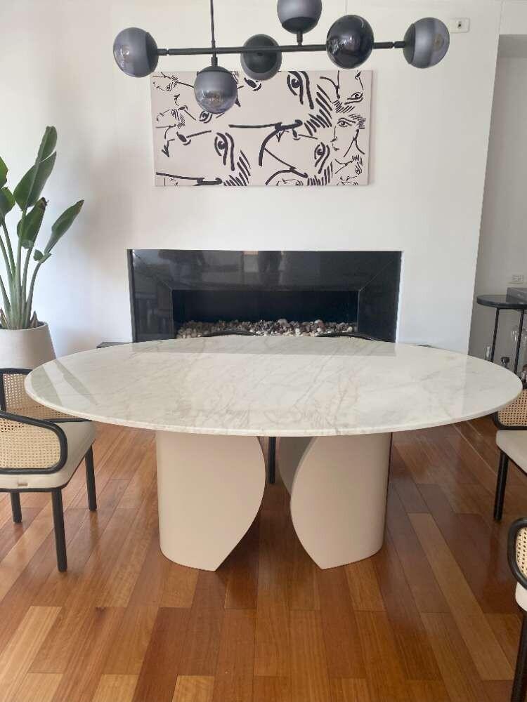 Taj Mahal oval dining table top made of sintered  stone having no facia with curved shaped joint metal leg base Real